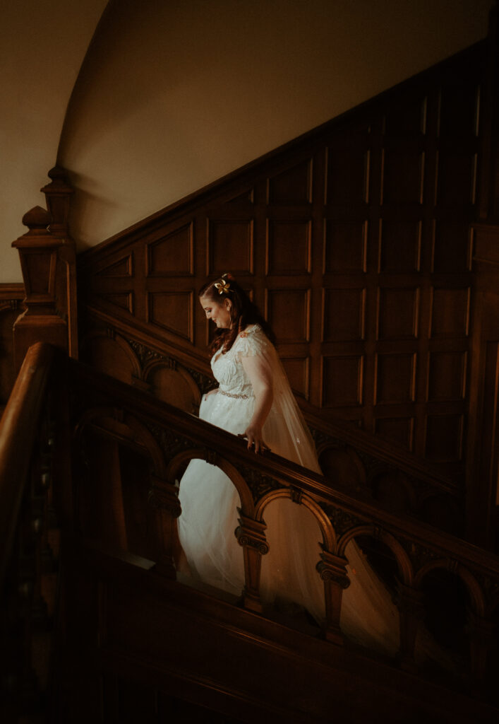 Bride walking up stairs at Laurel Hall in Indianapolis 