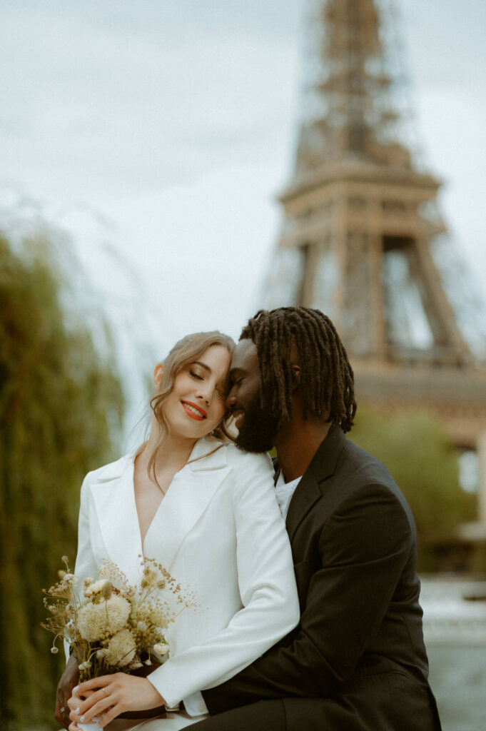 A couple eloping in Paris around the Eiffel Tower 
