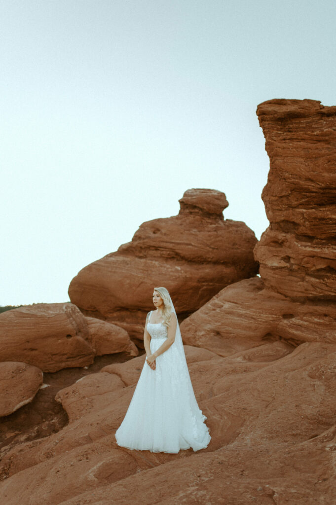 A bride looking etheral in garden of the gods at siamese twins against the red rocks of colorado