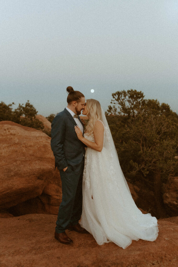 couple eloping under full moon in garden of the gods colorado